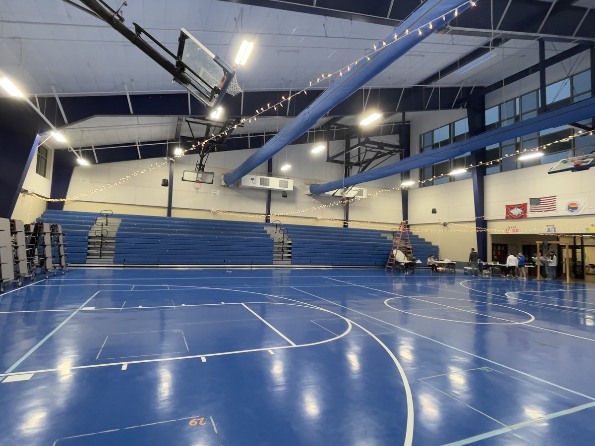 String lighting installed across the ceiling of a community venue